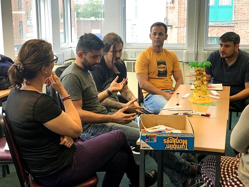 Teacher using gameboards in a classroom with their English students in Limerick.